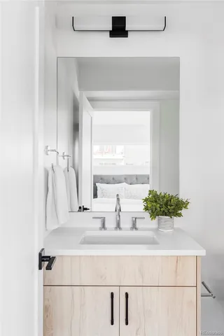 a bathroom with a sink and a mirror