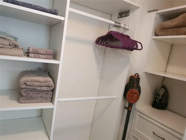 a kitchen with stainless steel appliances granite countertop a refrigerator sink and stove
