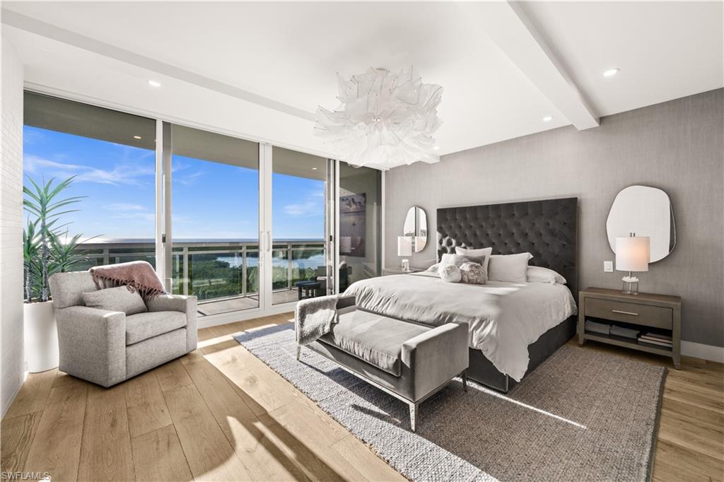 13925 Old Coast Road, Unit 1003 Naples, FL 34110 - Photo 13 of 33 Bedroom featuring access to exterior, beam ceiling, light wood-style floors, and recessed lighting