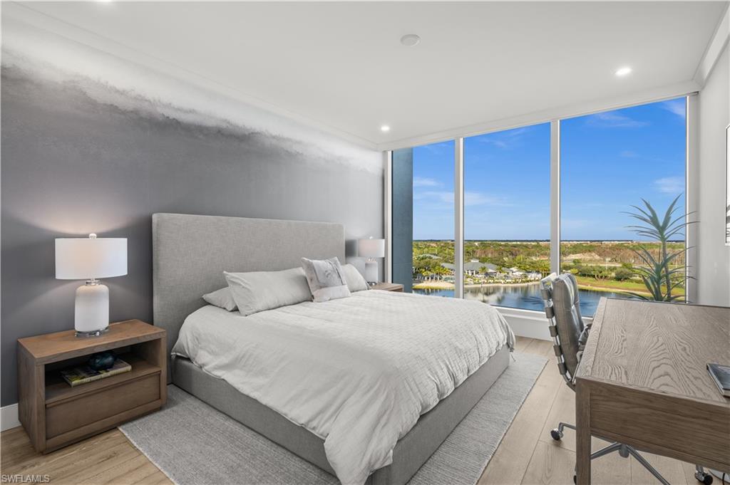 13925 Old Coast Road, Unit 1003 Naples, FL 34110 - Photo 17 of 33 Bedroom with expansive windows, a water view, light wood-style floors, and recessed lighting