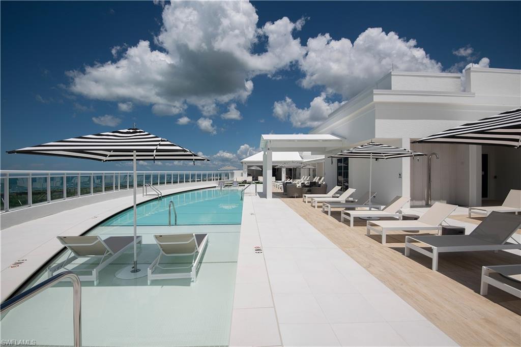 13925 Old Coast Road, Unit 1003 Naples, FL 34110 - Photo 30 of 33 Community pool featuring a patio area
