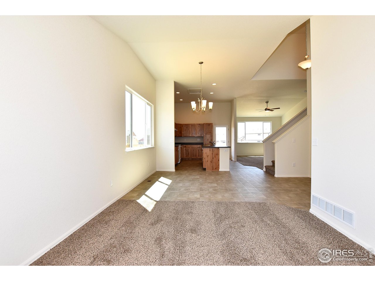 2304 Sublime Drive Windsor, CO 80550 - Photo 11 of 39 a view of a hallway with a kitchen