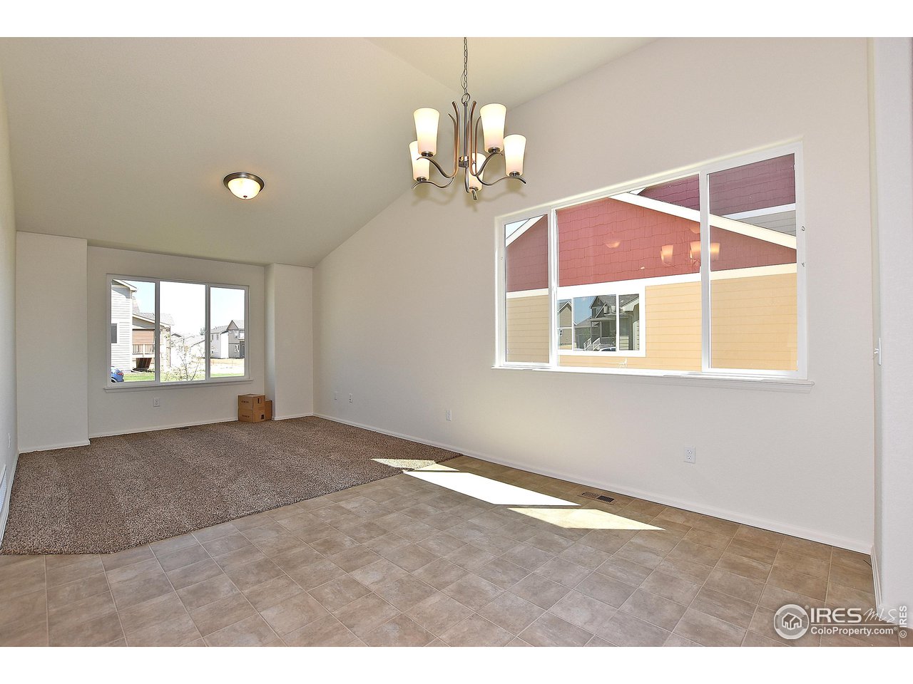 2304 Sublime Drive Windsor, CO 80550 - Photo 16 of 39 a view of an empty room with a window