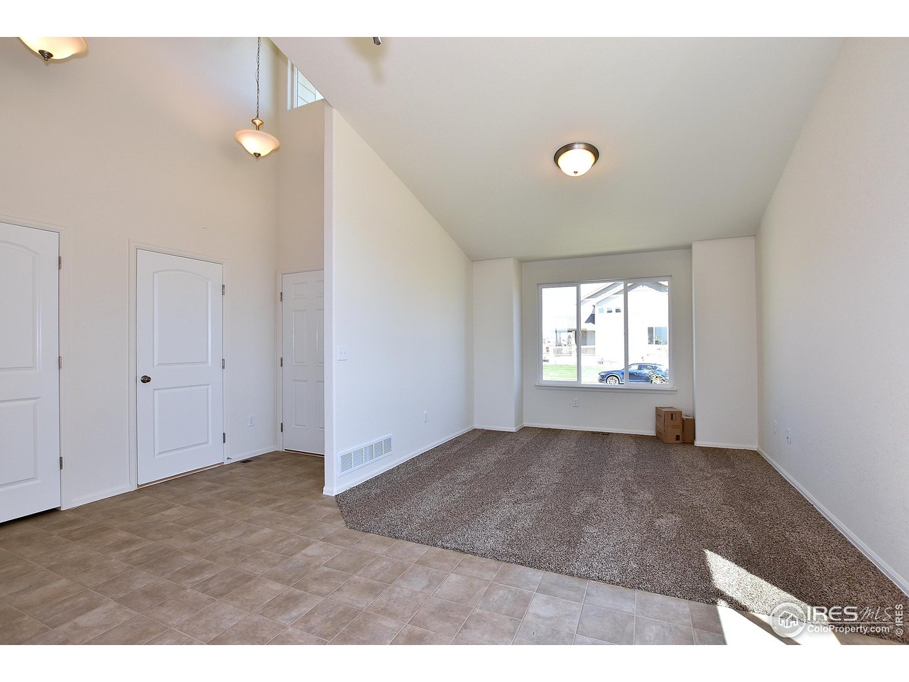 2304 Sublime Drive Windsor, CO 80550 - Photo 10 of 39 a view of an empty room with a window