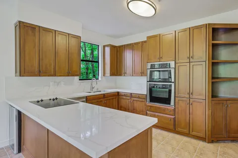 a kitchen that has a sink and a refrigerator
