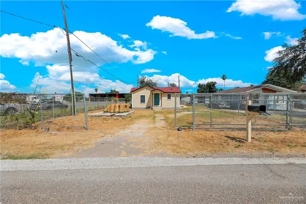 a view of a house with basketball court