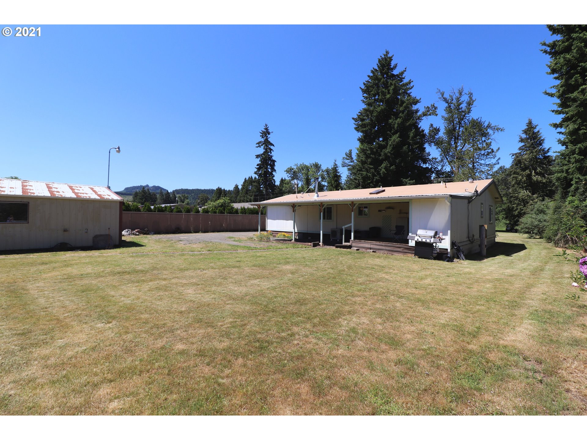 78471 Sears Road Cottage Grove, OR 97424 - Photo 23 of 31 a front view of a house with a yard