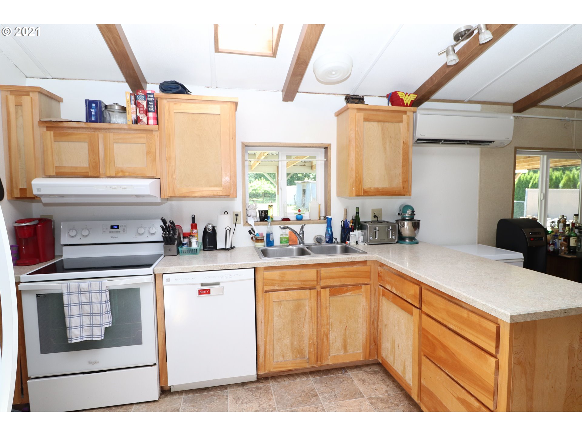 78471 Sears Road Cottage Grove, OR 97424 - Photo 7 of 31 a kitchen with a stove a sink and a microwave