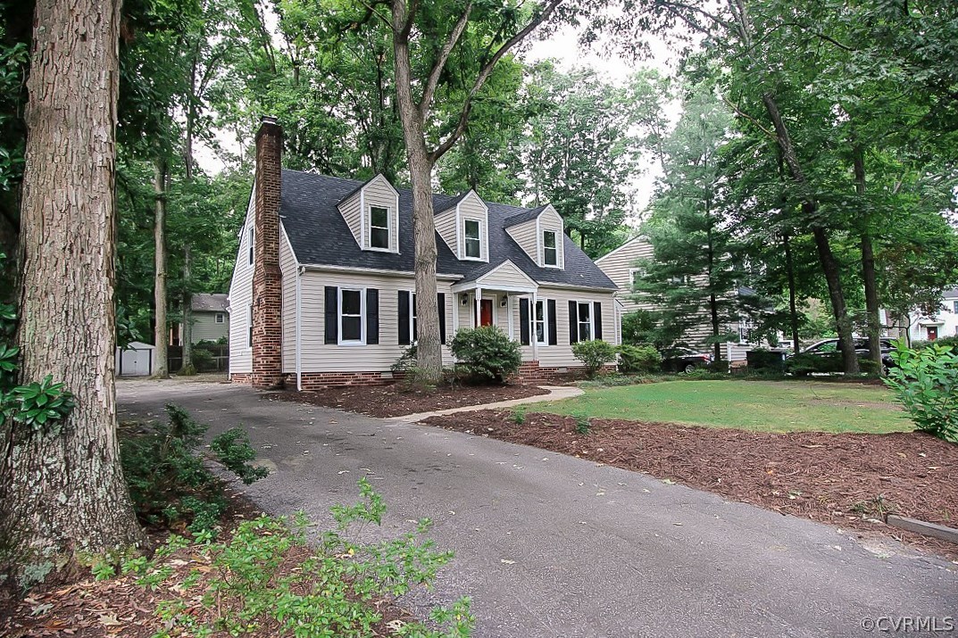 11201 Rockledge Road North Chesterfield, VA 23235 - Photo 3 of 25 a front view of a house with a yard and garage