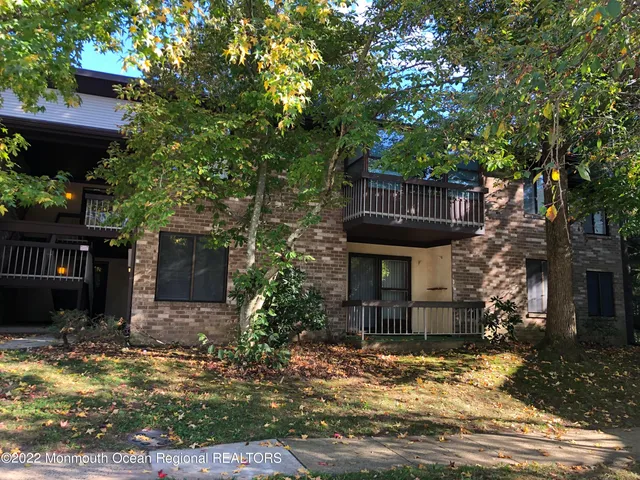a kitchen with stainless steel appliances granite countertop a refrigerator and a stove