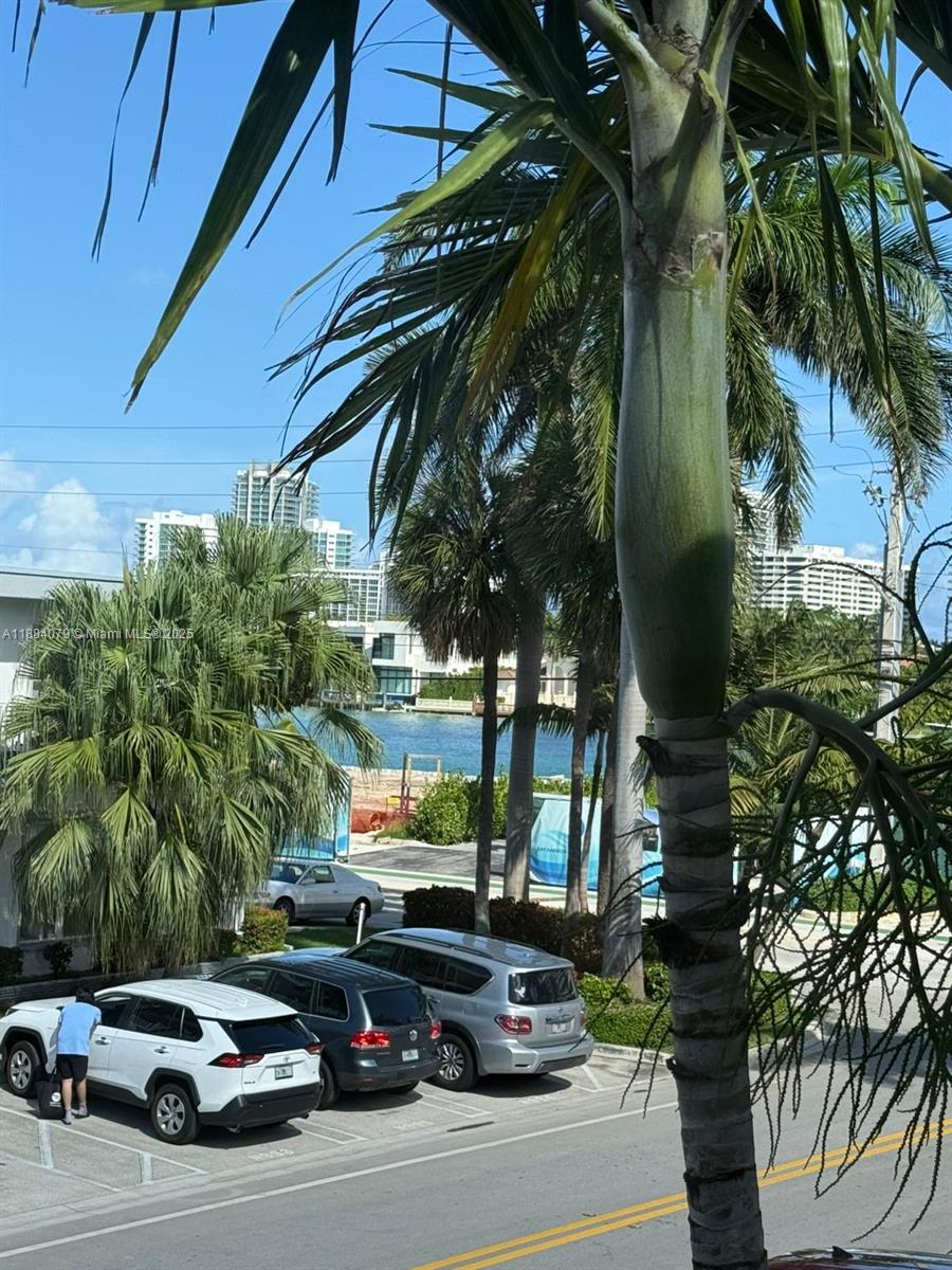 10074 East Bay Harbor Drive, Unit 74C Bay Harbor Islands, FL 33154 - Photo 17 of 28 a car parked in front of a house