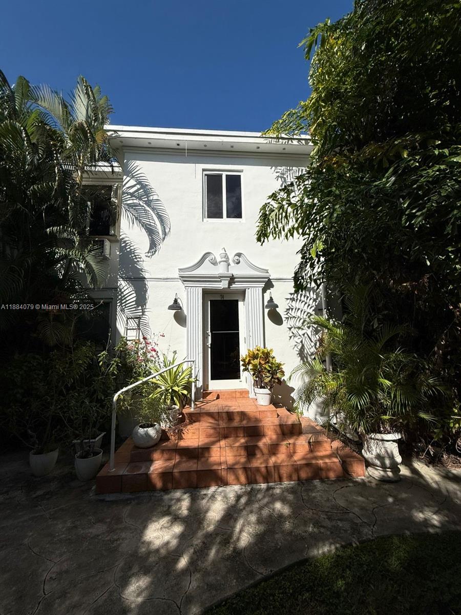 10074 East Bay Harbor Drive, Unit 74C Bay Harbor Islands, FL 33154 - Photo 21 of 28 a front view of a house with yard
