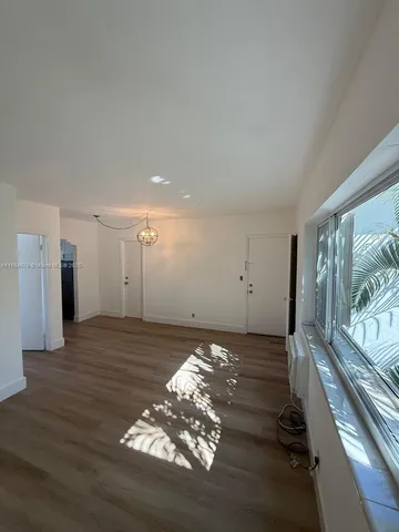 a view of a livingroom with wooden floor