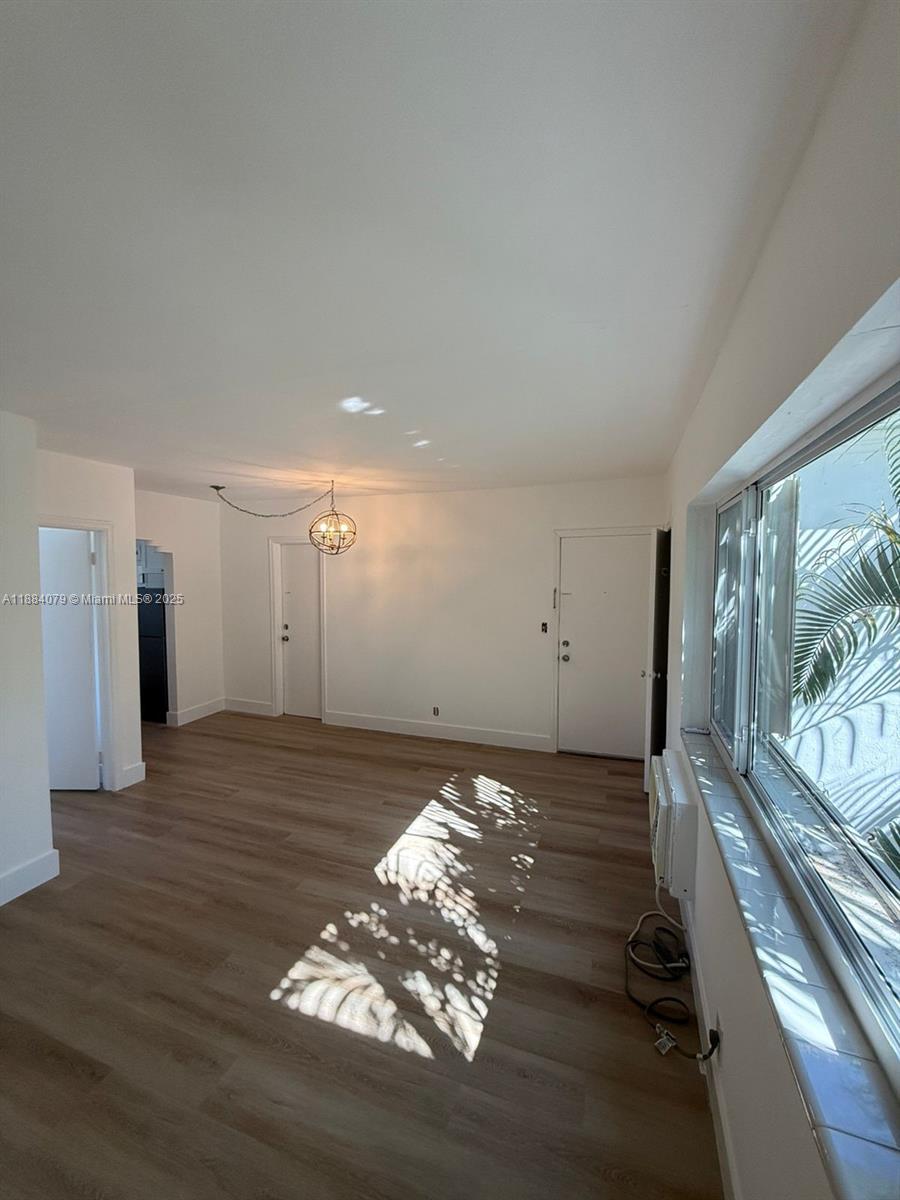 10074 East Bay Harbor Drive, Unit 74C Bay Harbor Islands, FL 33154 - Photo 3 of 28 a view of a livingroom with wooden floor
