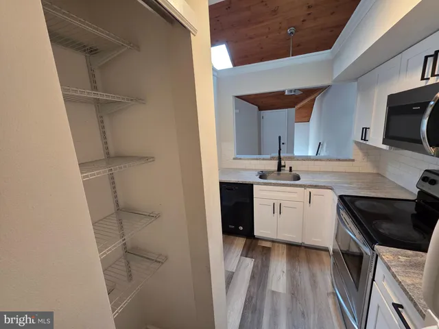 a kitchen with a stove and a microwave