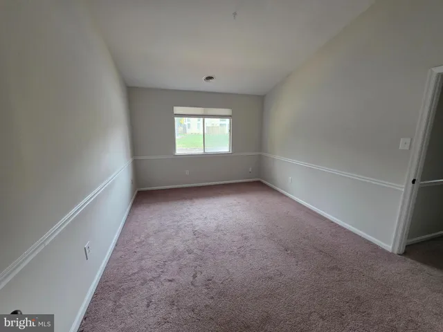 a view of a big room with closet and wooden floor