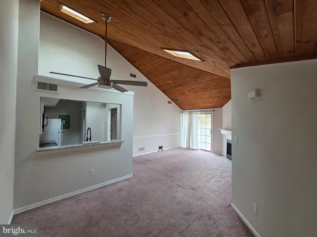a view of an empty room with a fireplace
