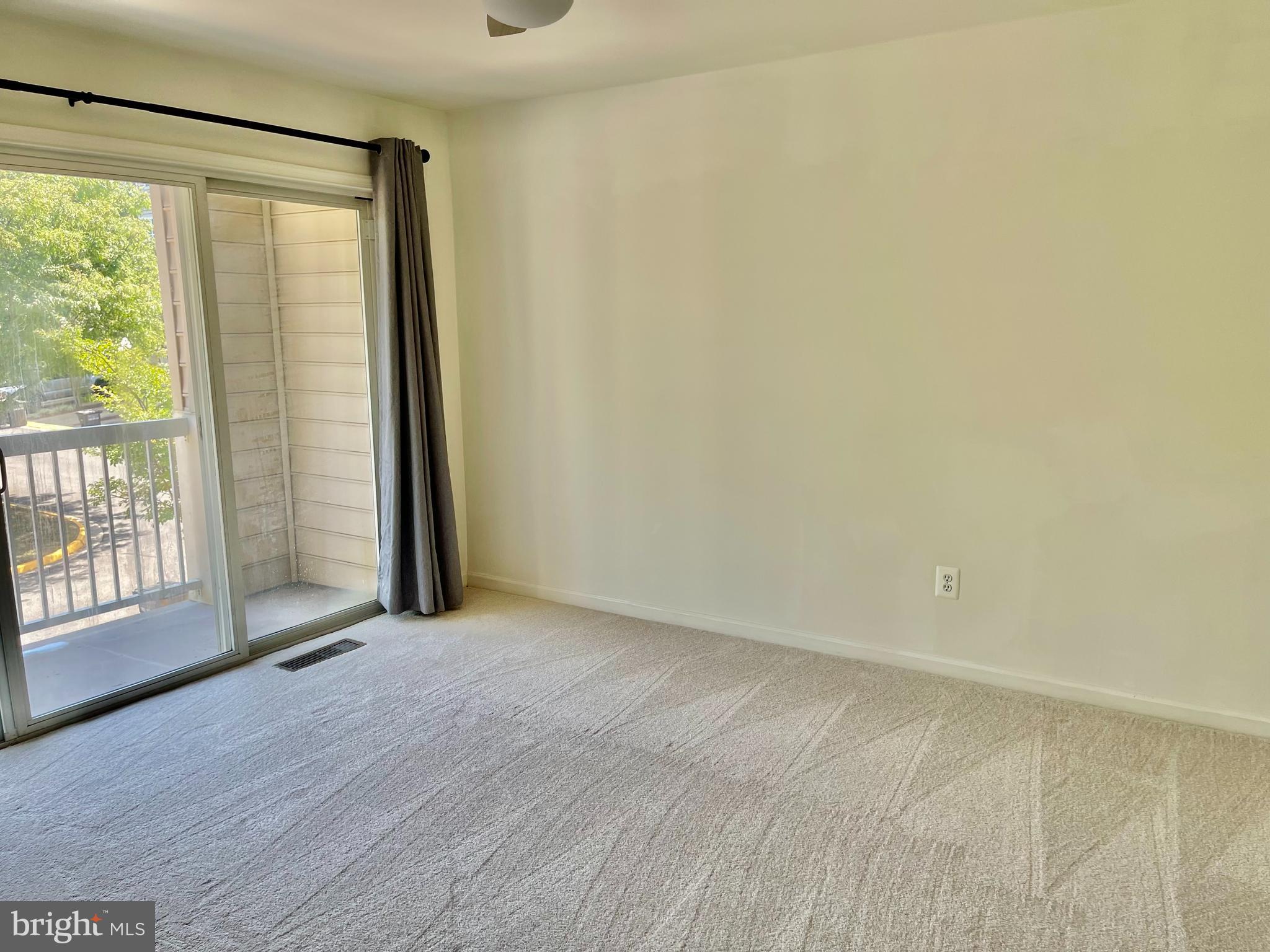 1883 Crescent Park Drive, Unit 112A Reston, VA 20190 - Photo 14 of 23 an empty room with windows