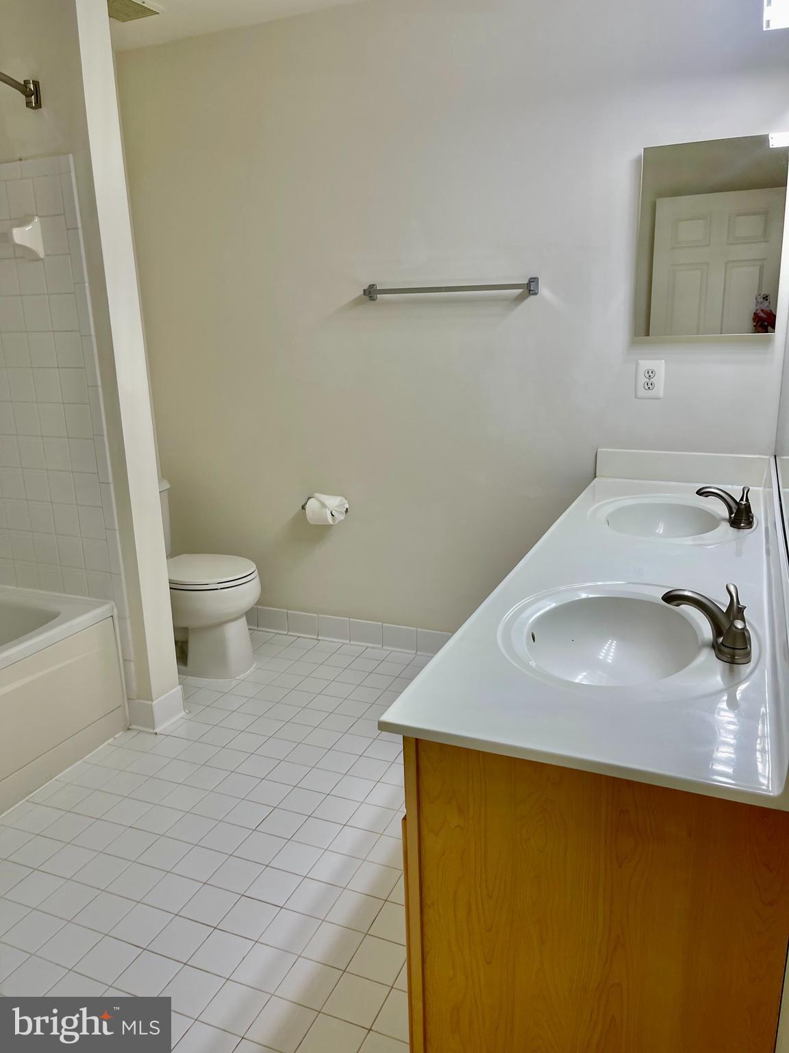 1883 Crescent Park Drive, Unit 112A Reston, VA 20190 - Photo 17 of 23 a bathroom with a sink and a toilet