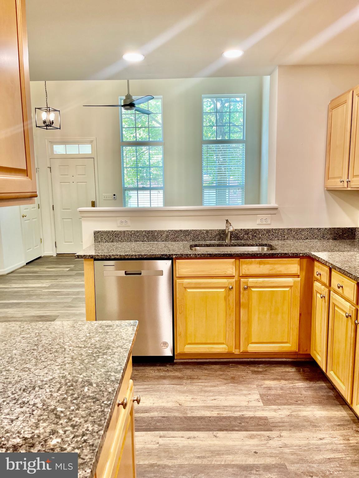 1883 Crescent Park Drive, Unit 112A Reston, VA 20190 - Photo 7 of 23 a view of a kitchen with granite countertop window and a sink