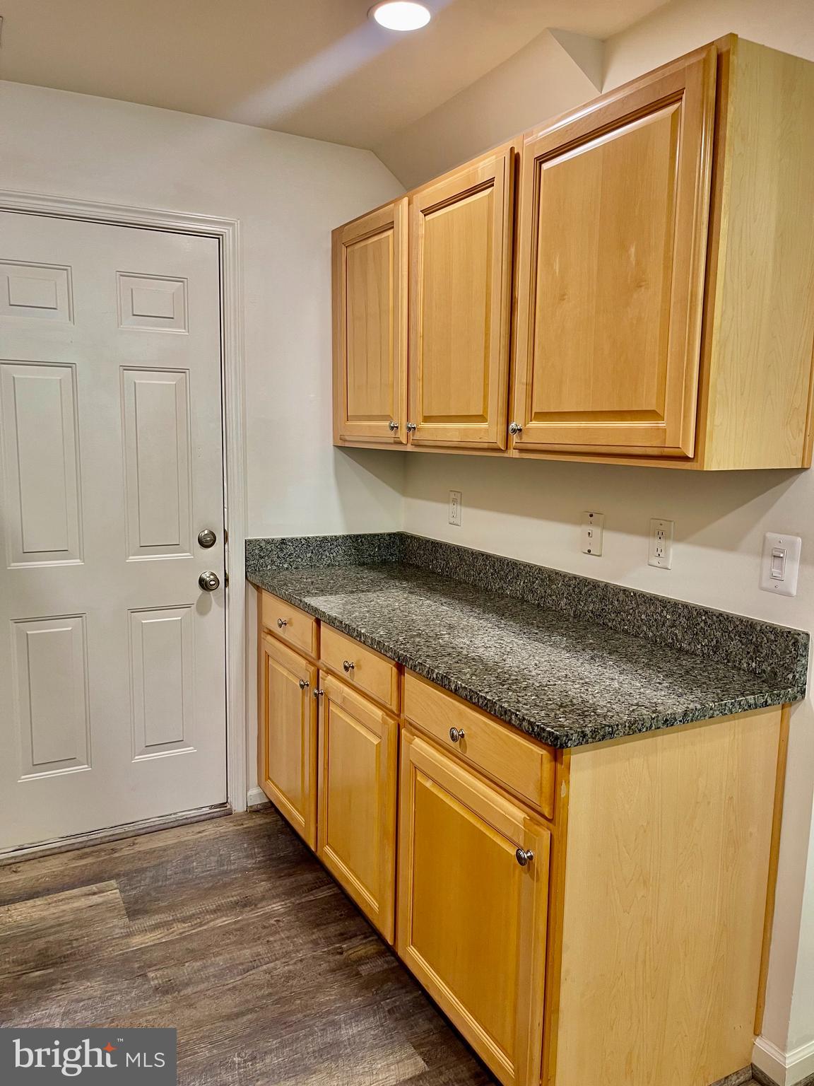 1883 Crescent Park Drive, Unit 112A Reston, VA 20190 - Photo 10 of 23 a kitchen with granite countertop cabinets and sink