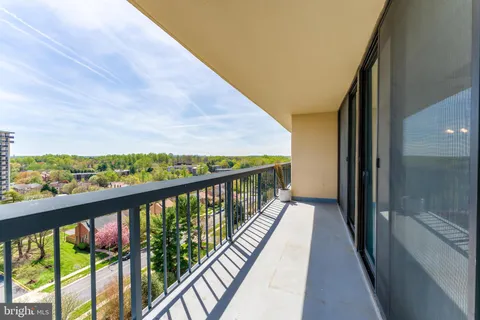 a view of balcony with furniture