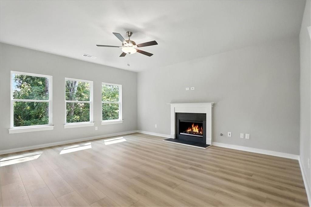 4034 Links Boulevard Jefferson, GA 30549 - Photo 11 of 68 a view of an empty room with a window and fireplace