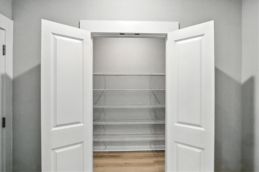 4034 Links Boulevard Jefferson, GA 30549 - Photo 20 of 68 a view of walk in closet with empty racks