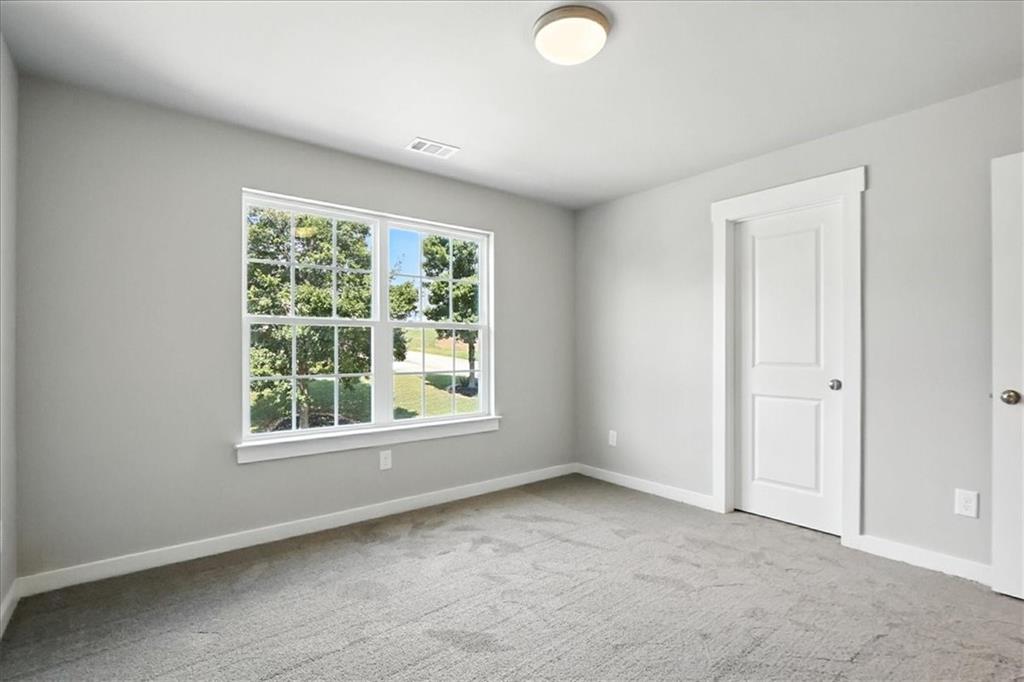 4034 Links Boulevard Jefferson, GA 30549 - Photo 39 of 68 an empty room with windows
