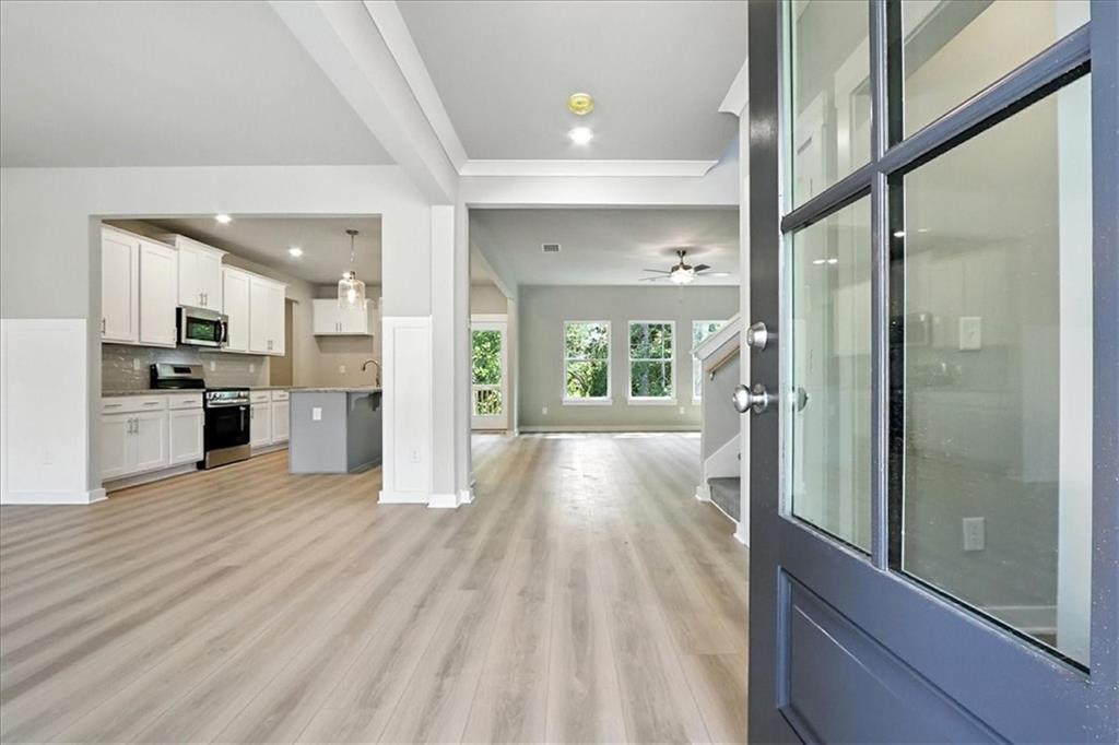 4034 Links Boulevard Jefferson, GA 30549 - Photo 4 of 68 a view of a kitchen with a refrigerator and a stove top oven