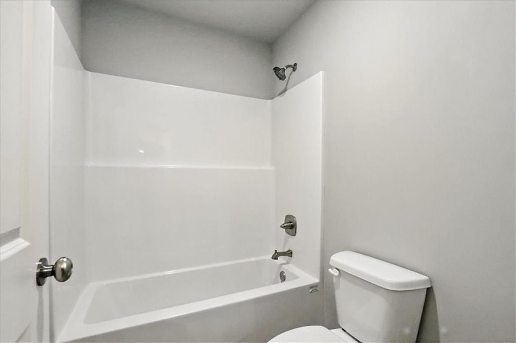 4034 Links Boulevard Jefferson, GA 30549 - Photo 46 of 68 a white toilet sitting next to a bath tub