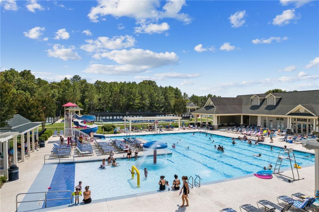 4034 Links Boulevard Jefferson, GA 30549 - Photo 60 of 68 a view of a swimming pool with a patio and a garden