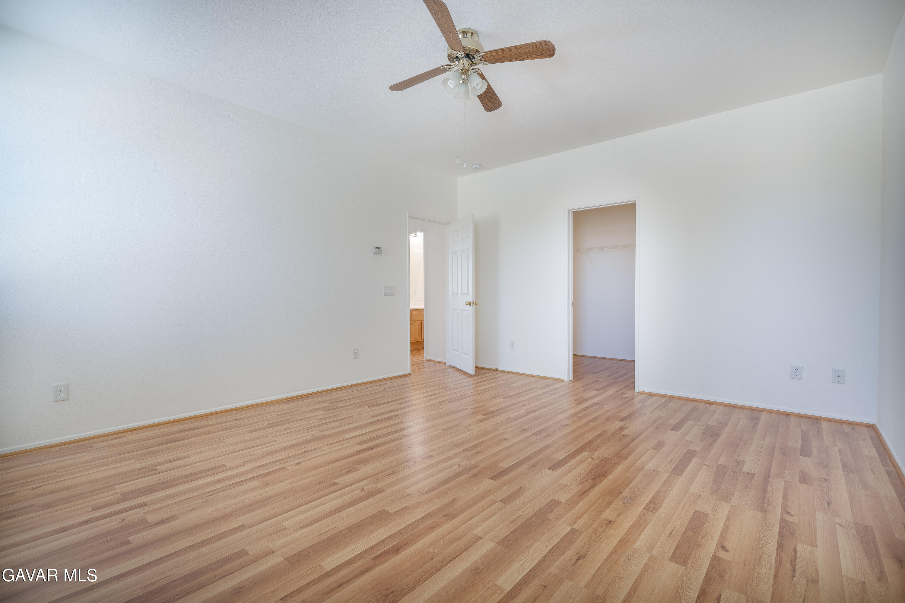 40263 Preston Road Palmdale, CA 93551 - Photo 16 of 24 a view of empty room with wooden floor and fan