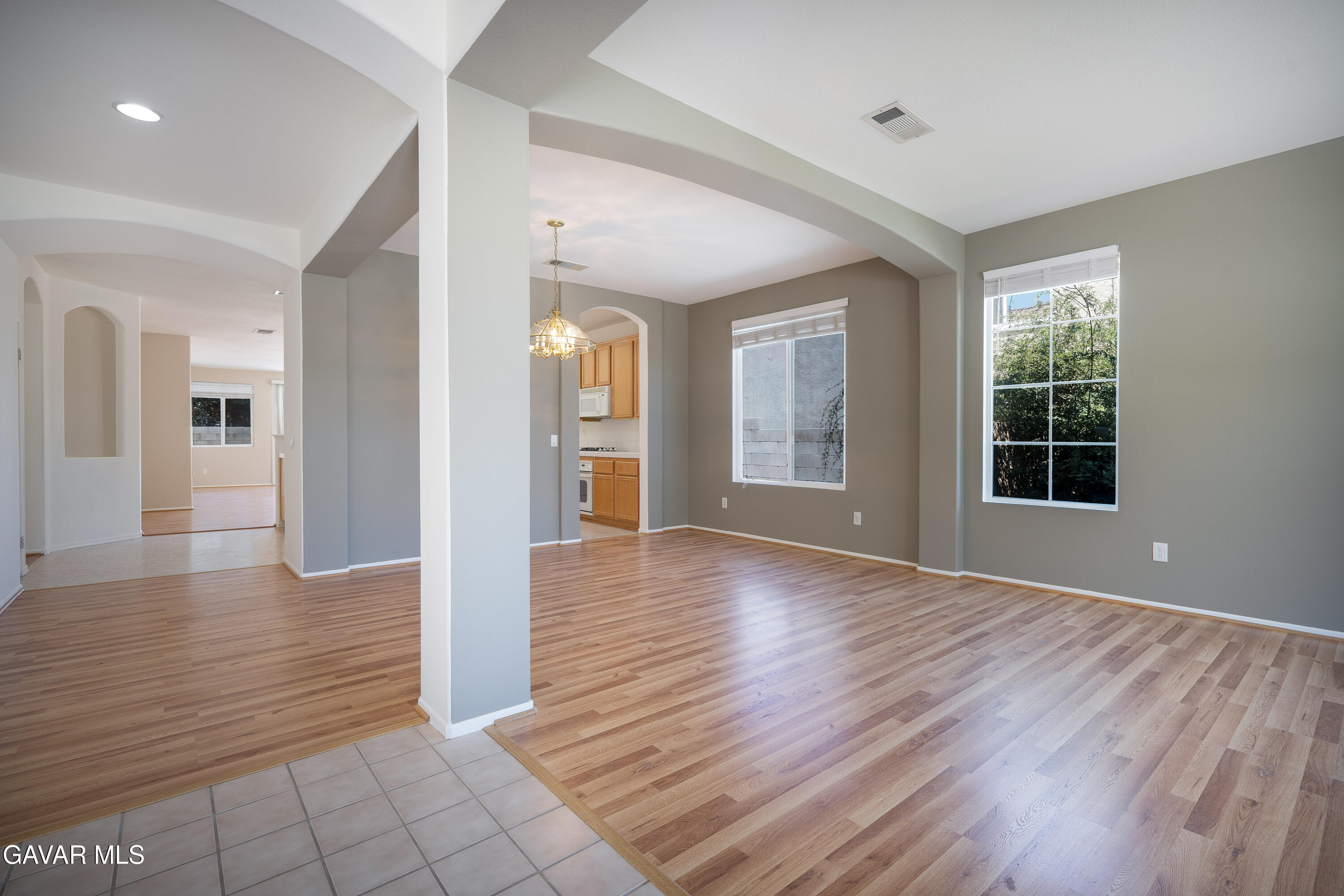 40263 Preston Road Palmdale, CA 93551 - Photo 19 of 24 a view of an empty room with window and wooden floor