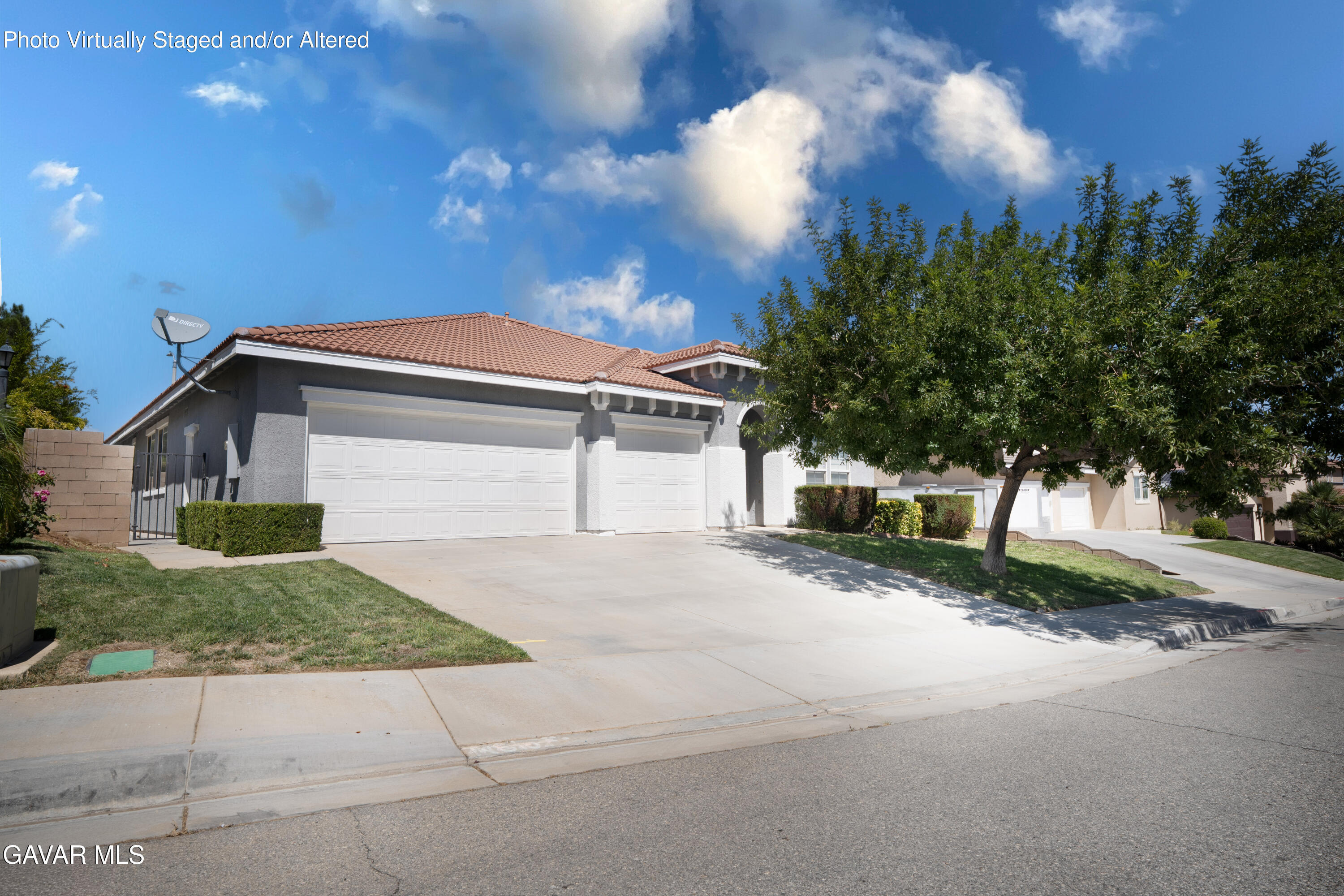 40263 Preston Road Palmdale, CA 93551 - Photo 2 of 24 a front view of a house with a yard and garage