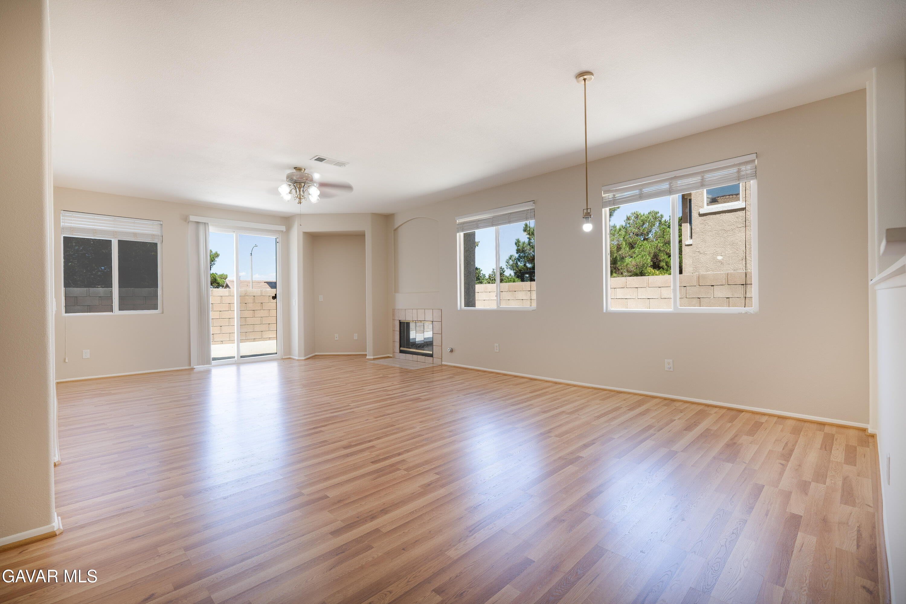 40263 Preston Road Palmdale, CA 93551 - Photo 24 of 24 a view of an empty room with wooden floor and a window