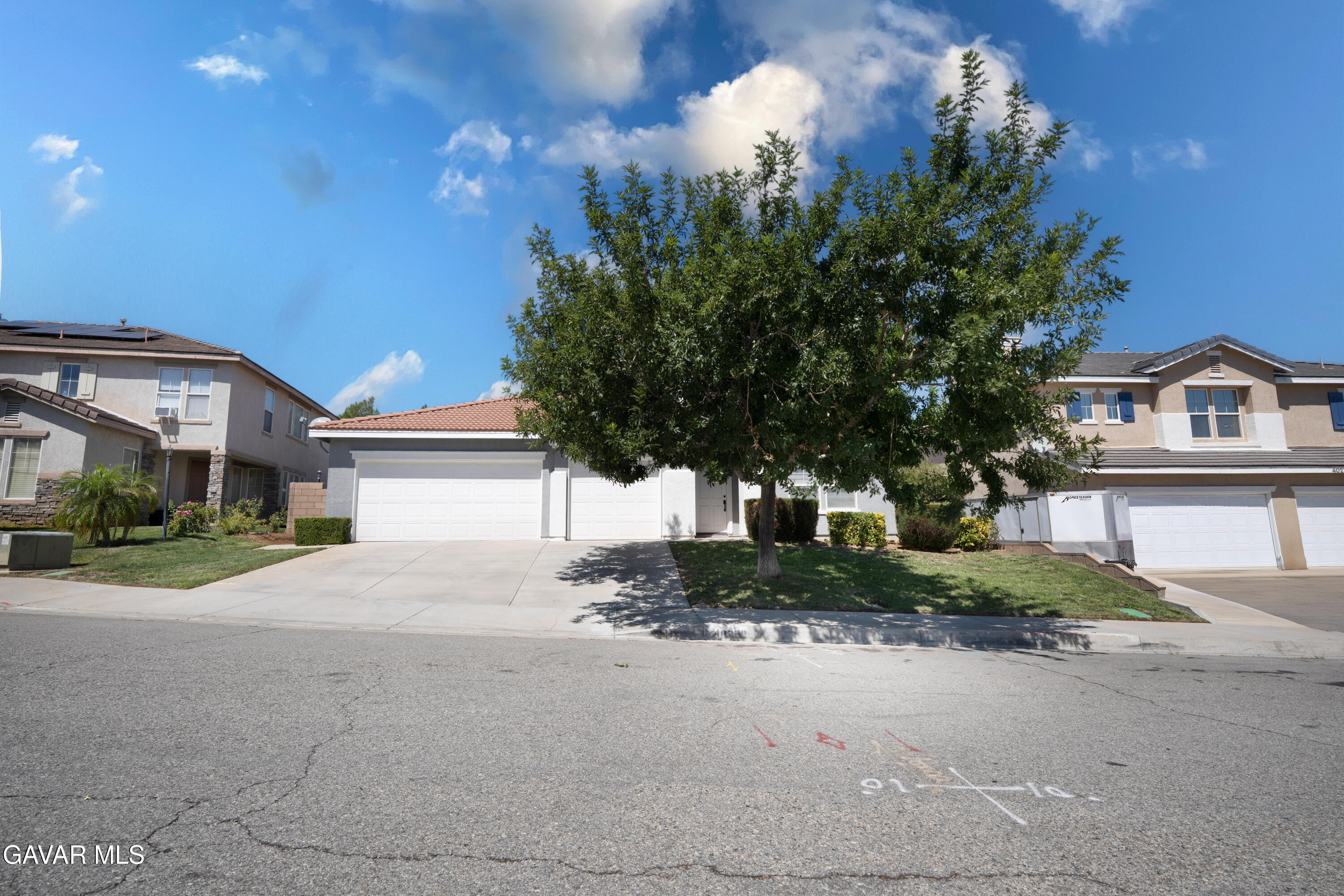 40263 Preston Road Palmdale, CA 93551 - Photo 3 of 24 a view of a house with a yard and large trees