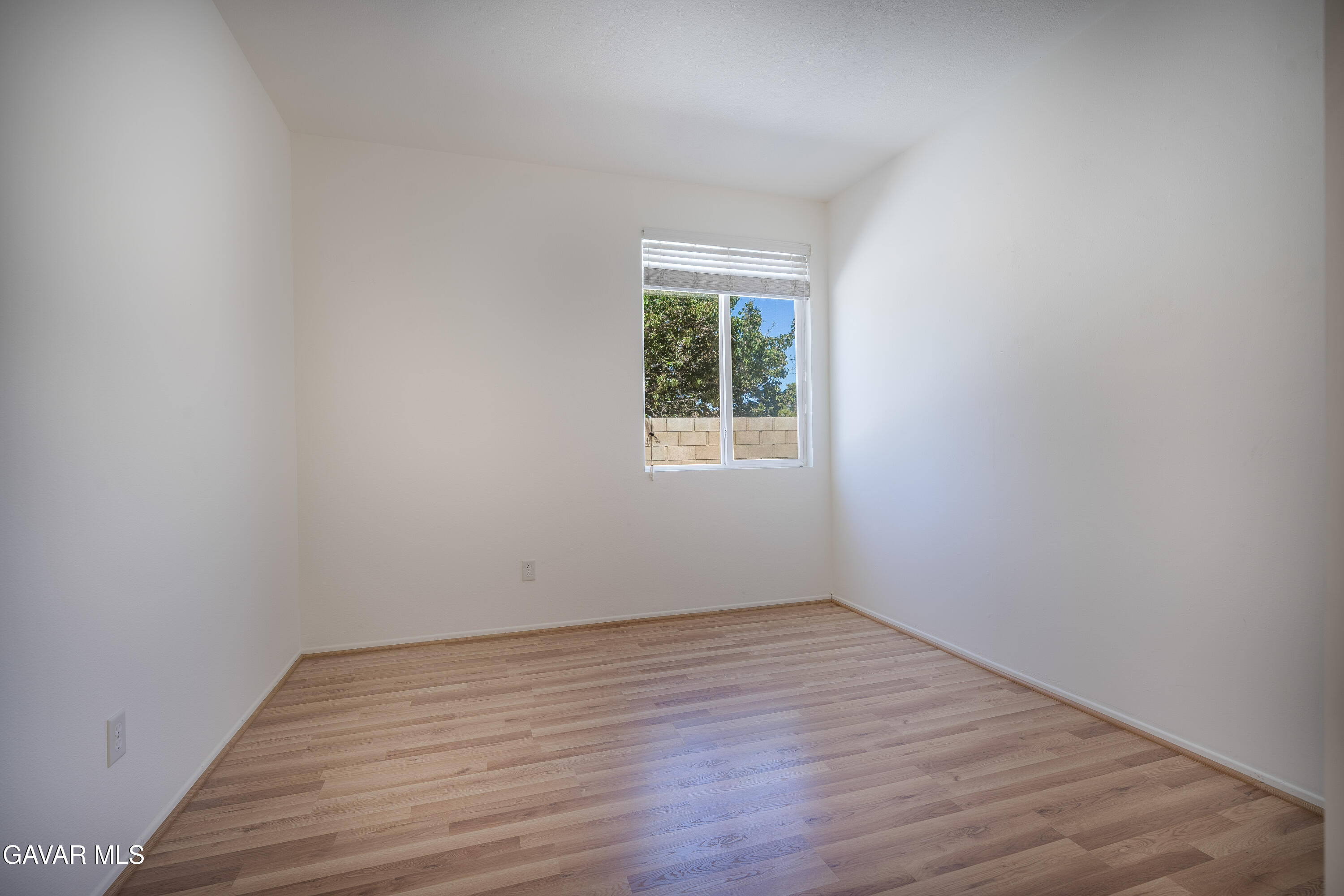 40263 Preston Road Palmdale, CA 93551 - Photo 5 of 24 wooden floor in an empty room with a window