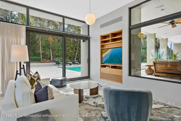 a kitchen with stainless steel appliances granite countertop wooden floor dining table and chairs