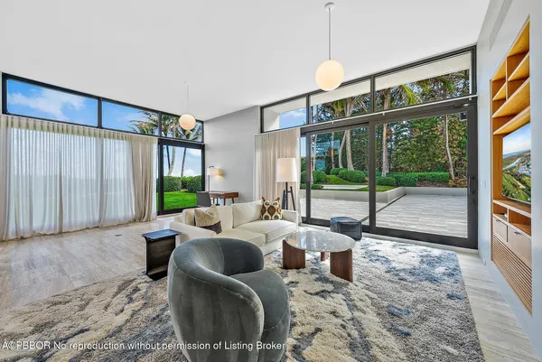 a large kitchen with stainless steel appliances granite countertop a lot of counter space and a sink
