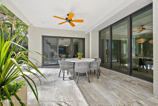 a bed sitting in a bedroom next to a large window with outer view