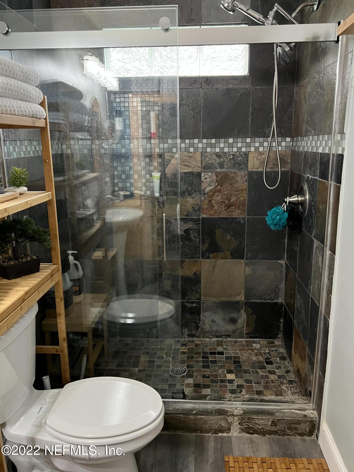 6044 West Shores Road Fleming Island, FL 32003 - Photo 11 of 18 a bathroom with a shower