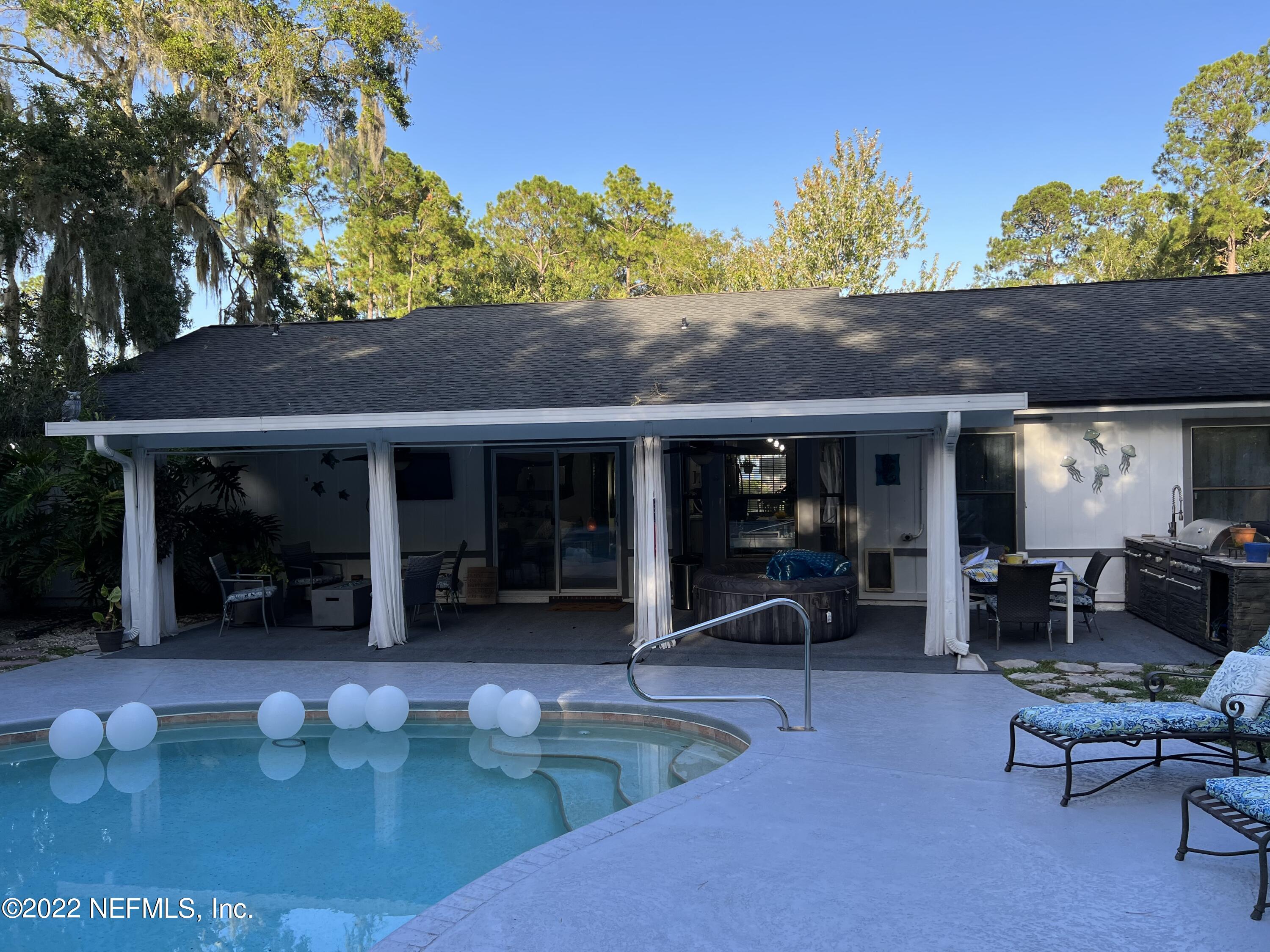 6044 West Shores Road Fleming Island, FL 32003 - Photo 3 of 18 a view of a house with patio
