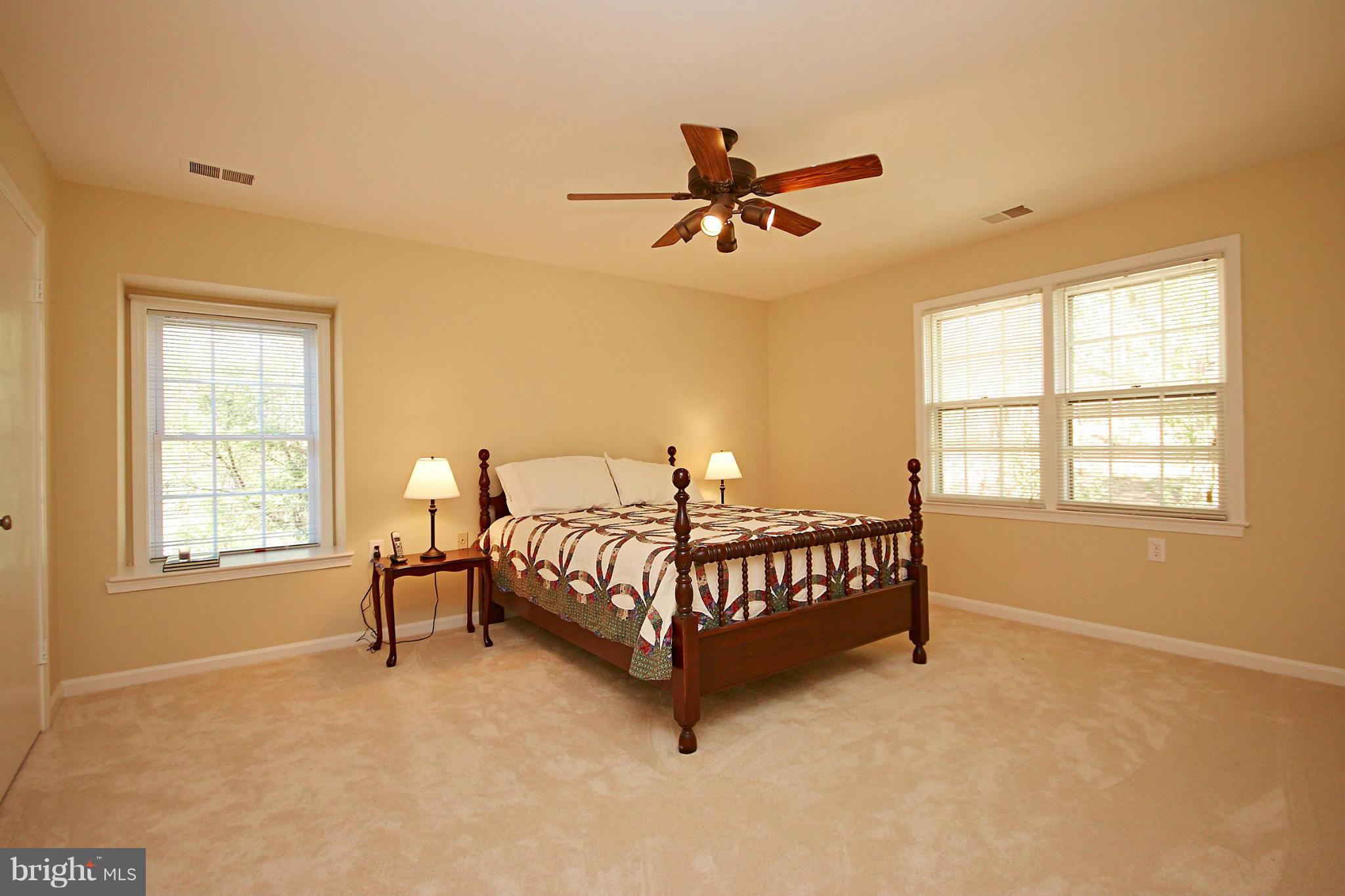 11012 Raccoon Ridge Court Reston, VA 20191 - Photo 22 of 28 a bedroom with a bed window and a window