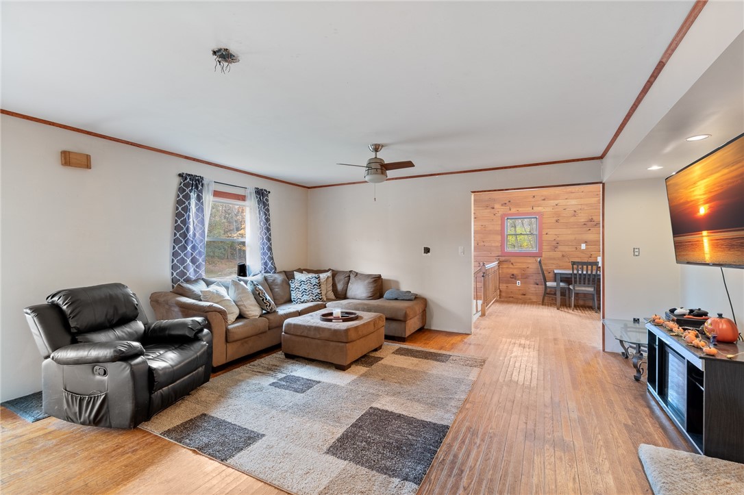 7779 Brown Road Wolcott, NY 14590 - Photo 13 of 37 The living room to the dining area - REAL HARDWOOD