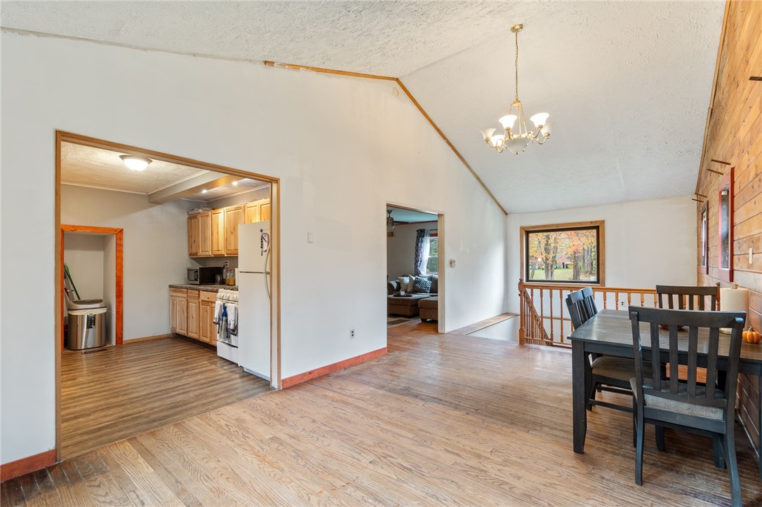 7779 Brown Road Wolcott, NY 14590 - Photo 14 of 37 Dining to kitchen and another living space on the