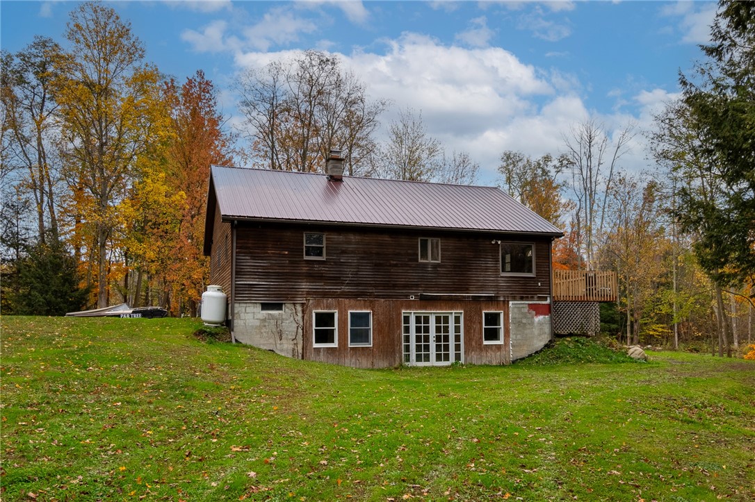7779 Brown Road Wolcott, NY 14590 - Photo 6 of 37 The rear view of the WALK OUT lower level- so much