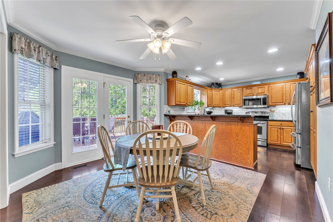 154 Hammond School Road Anderson, SC 29621 - Photo 7 of 33 This inviting kitchen and dining area offers direct access to outdoor living, perfect for gatherings.