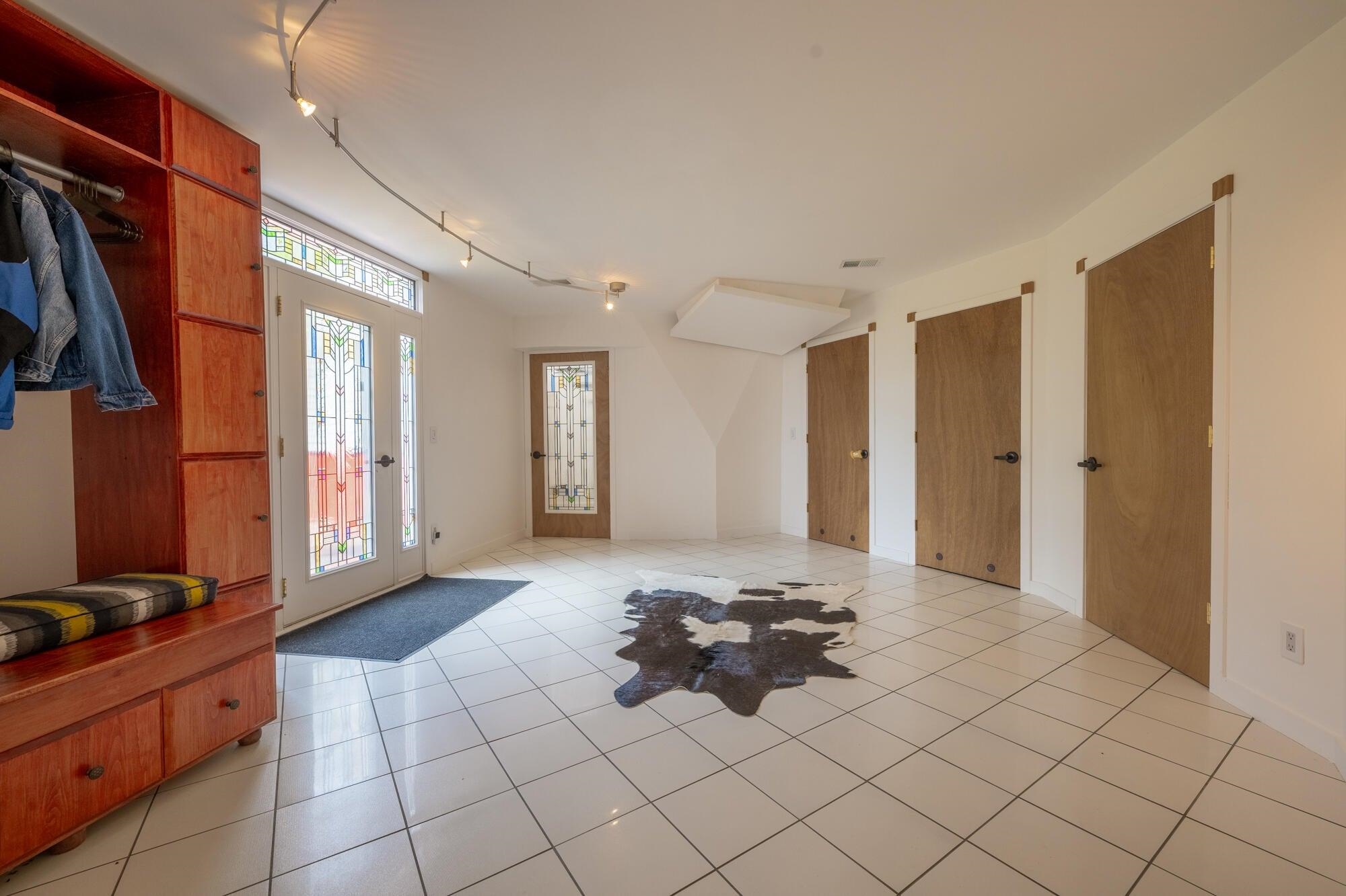 4745 Plank Road Natural Bridge, VA 24578 - Photo 16 of 75 Enter into the Foyer with tile floors, Clothing rack, doors to utility spaces.