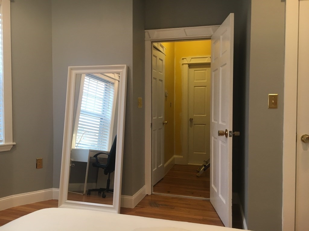 102 Moreland Street Boston, MA 02119 - Photo 14 of 31 a view of a bathroom from a hallway